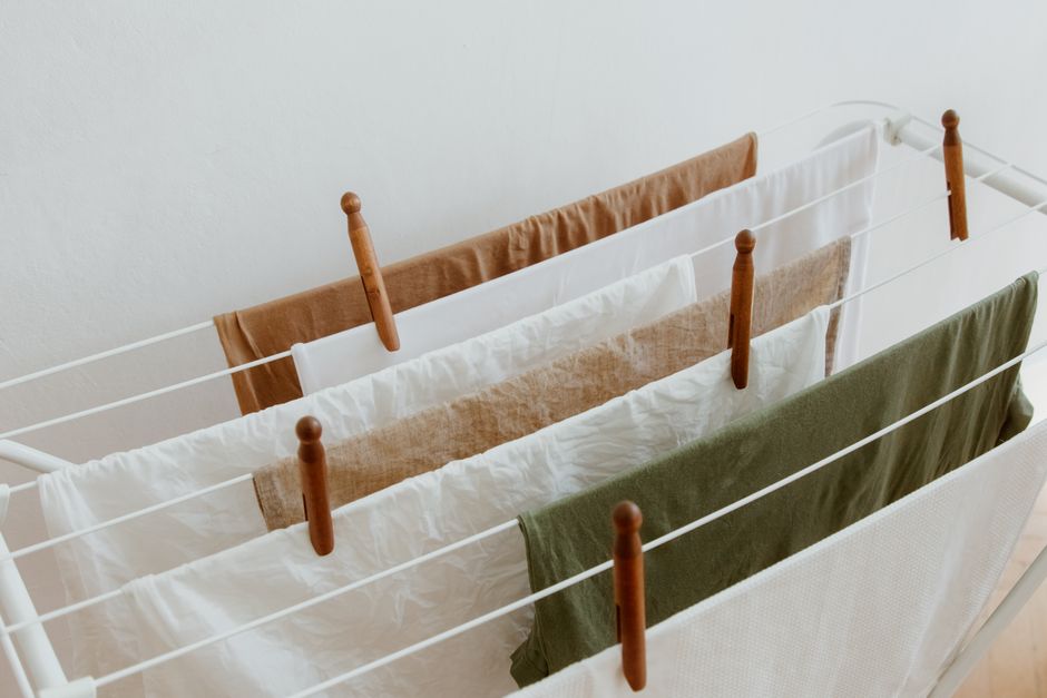 Compact dehumidifier drying laundry inside a flat